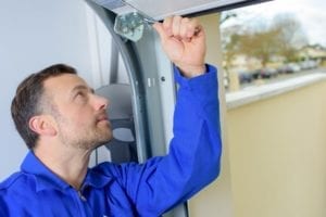 Man installing a garage door