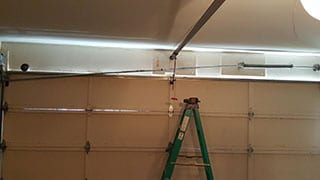 The qualified technicians of Action Garage Doors were called to this residential Dallas Texas home to repair and replace a broken garage door spring