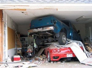 destructive garage door accident involving two vehicles