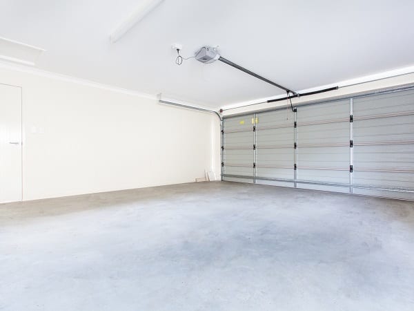 Empty double garage with automatic door