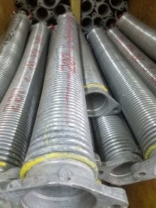 garage door springs new bulk garage door springs on a warehouse shelf