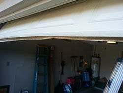 This home located in Garland Texas had a garage door panel and seal in need of being repaired or replace by Action Garage Doors technicians