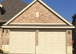 This Grand Prairie Texas home received two single car steel garage door installed and repaired by technician Ryan Beck of Action Garage Doors
