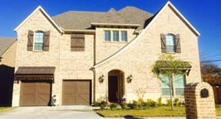 A beautiful install and repair of two custom single car wood garage doors on this residential home in Grapevine Texas by Action Garage Doors