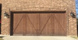 Half bucks, carriage style wooden garage install for new home in Flower Mound Texas by the experts at Action Garage Door