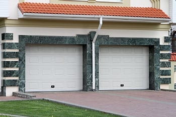 Action Garage Doors install, repair, service, and maintenance of steel garage doors for 2 cars with a marble fascia in Euless Texas a suburb of Fort Worth