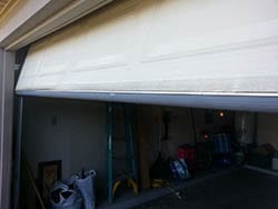 Technician R Floutin of Action Garage Doors installed and repaired this garage door with a new panel and seal at a home in Mesquite Texas