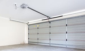 Residential empty double car garage with automatic door opener 