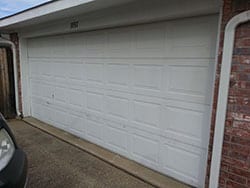 The finished product of Action Garage Doors repairing the broken garage door panel by installing and repairing it in Rockwall Texas