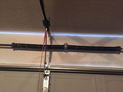 Action Garage Door was summoned to this residence in Richardson Texas because of the garage door opener spring broke and needed to be replaced