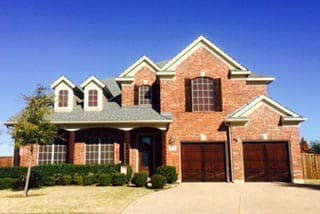 Totally unique custom wood single car garage doors installed and repaired in Flower Mound Texas by Action Garage Doors of Plano Tx